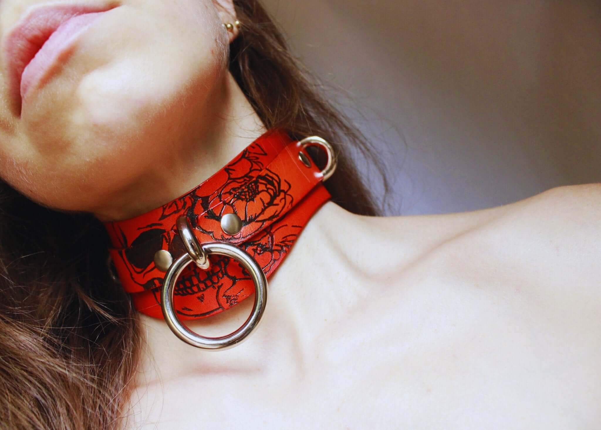 Bold Skull leather collar showcasing a striking red design, ideal for BDSM and submissive style accessories.