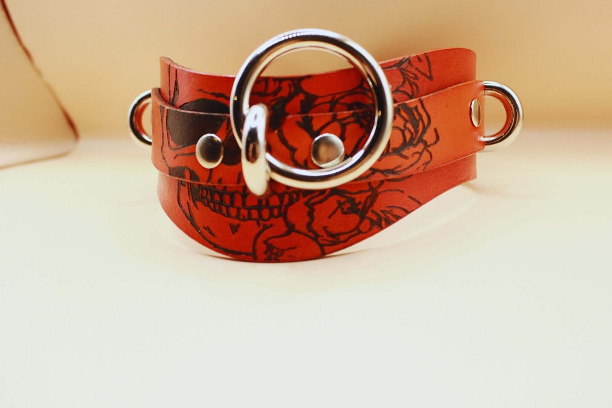 Bold Skull leather BDSM collar with ring, perfect for submissive jewelry and bondage gear.