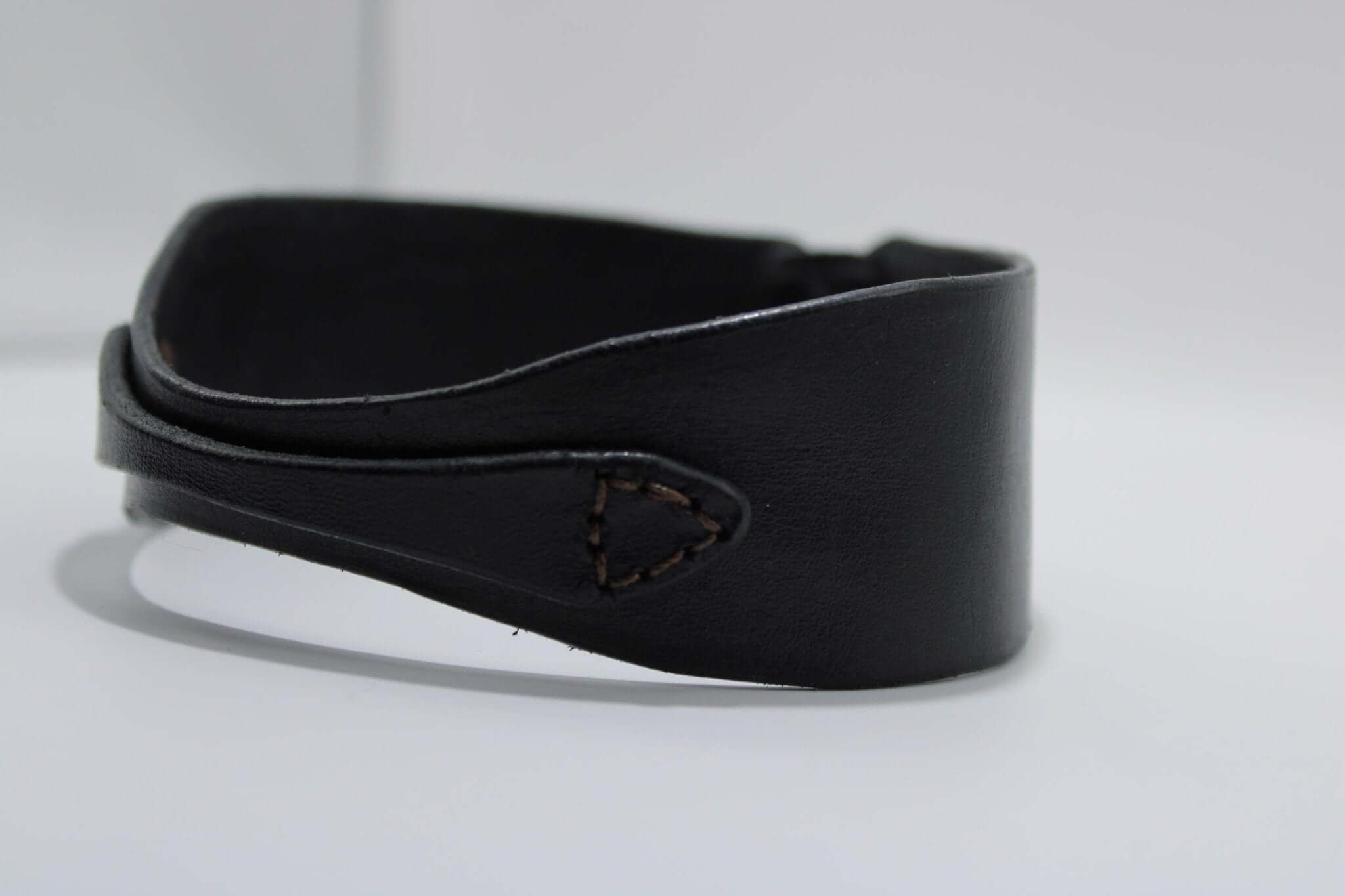 Sleek black leather choker collar, a perfect accessory for BDSM, bondage, and submissive jewelry enthusiasts.