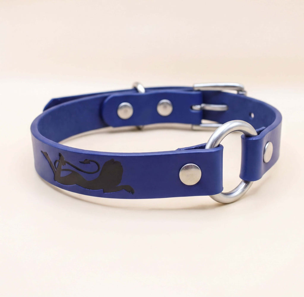 A blue leather dog collar with a silver buckle and a black silhouette of a dog.