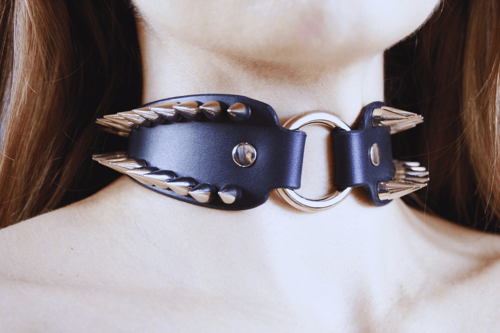 Spiked Submissive Collar worn as a gothic BDSM choker featuring metal spikes and a polished D-ring.