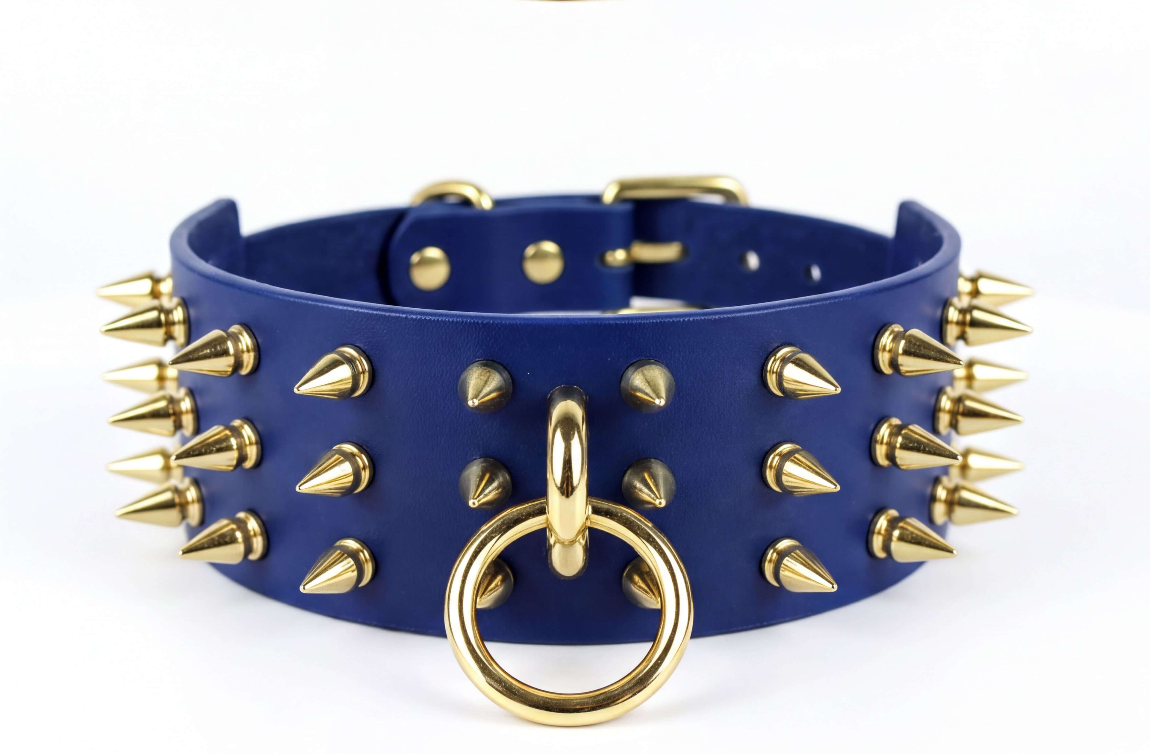 A blue leather choker necklace with gold spikes protruding from it.