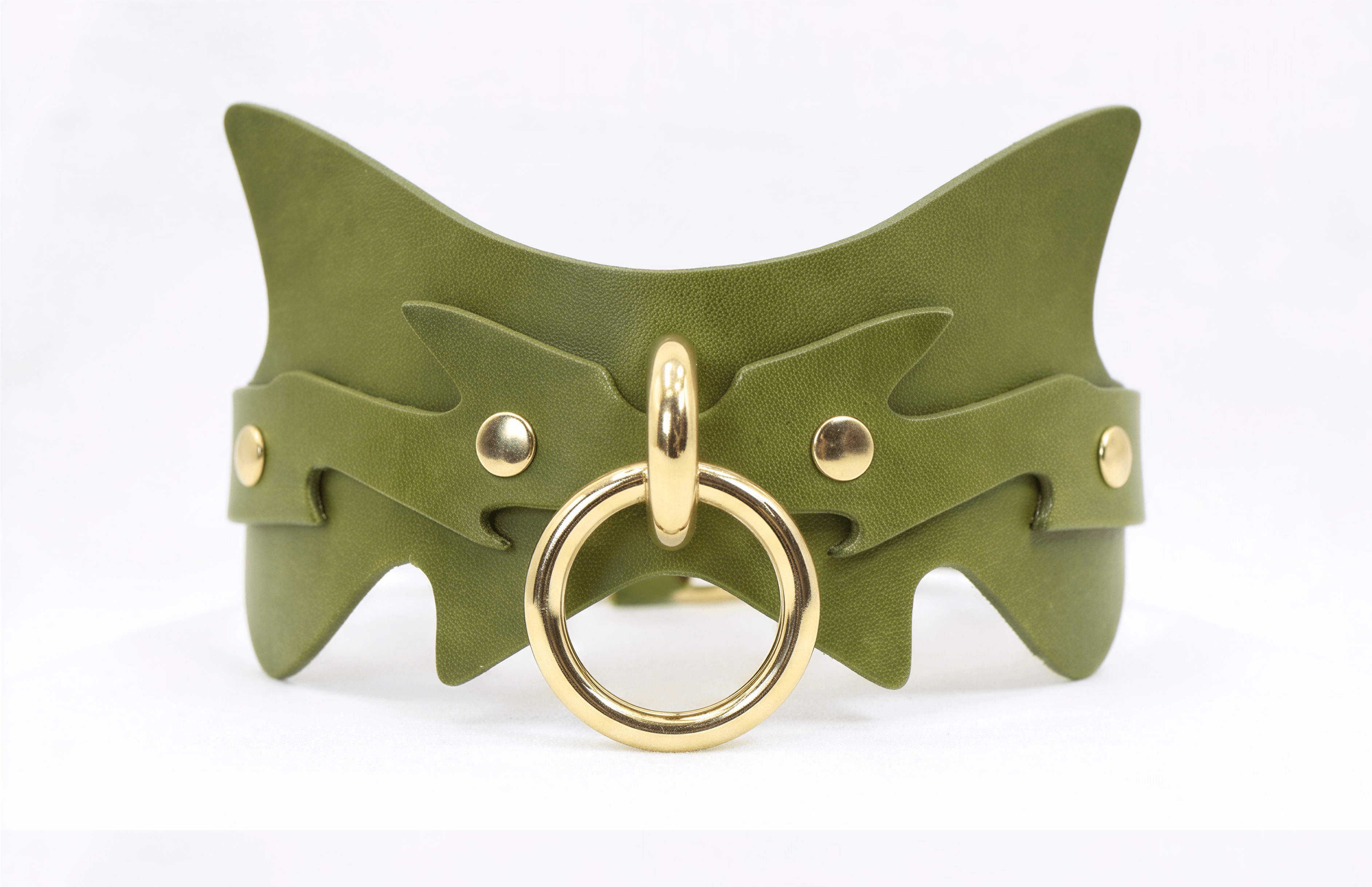 A green leather choker necklace with a gold-colored metal ring and two gold-colored metal studs on the sides.