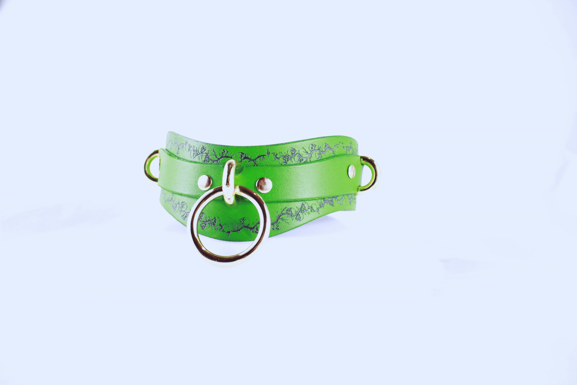 Skull Leather Choker featuring a vibrant green design with floral motifs and circular metal ring detail
