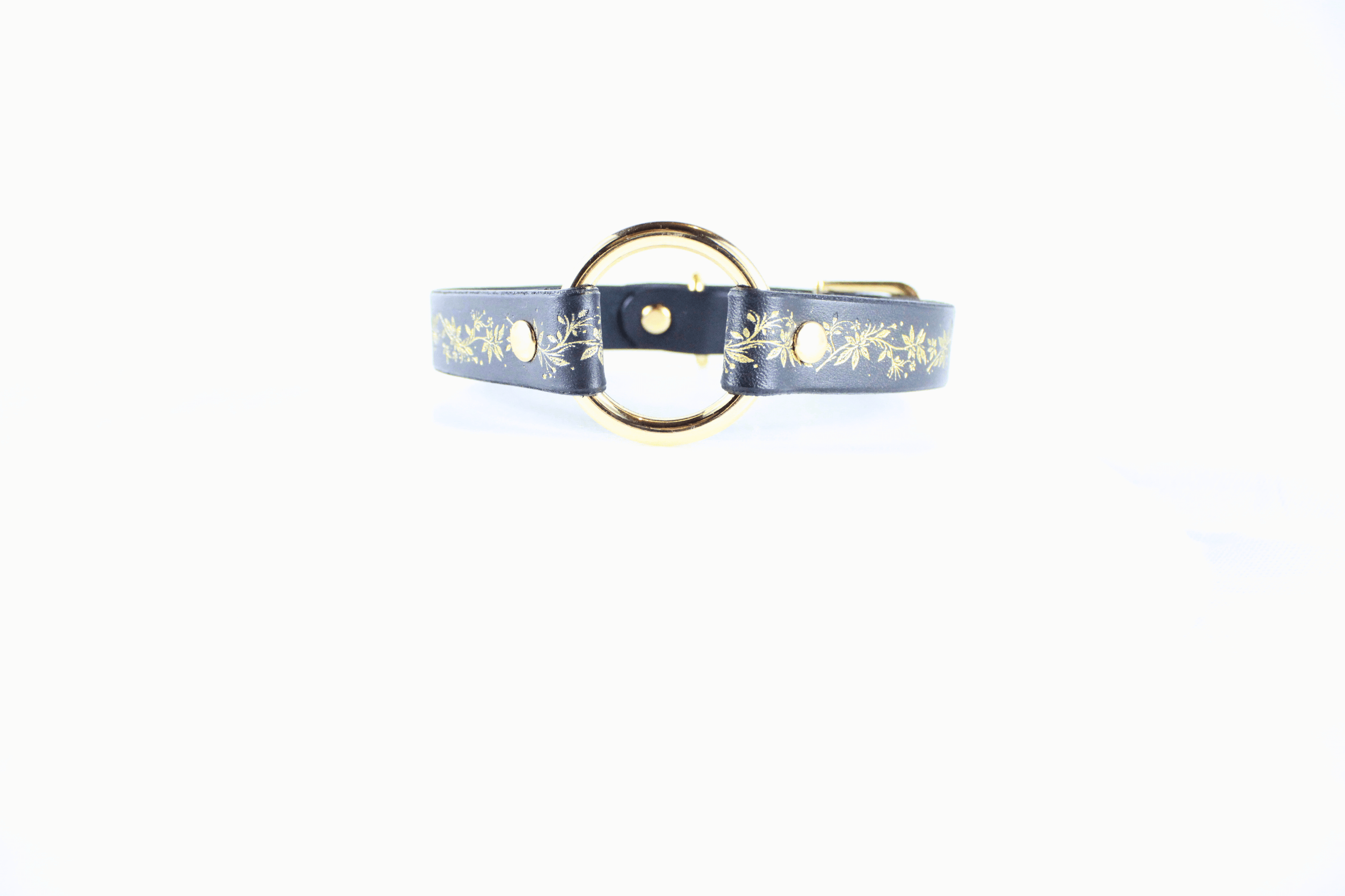 Black Leather Fetish Collar with golden floral pattern and polished O-ring for elegant and subtle appeal.