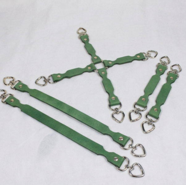 A group of green leather straps with metal heart-shaped buckles, arranged in a cross-like pattern on a white background.