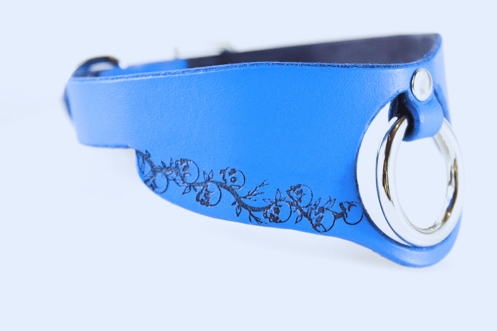 Blue leather submissive collar with floral pattern and silver ring, perfect for discreet day wear.
