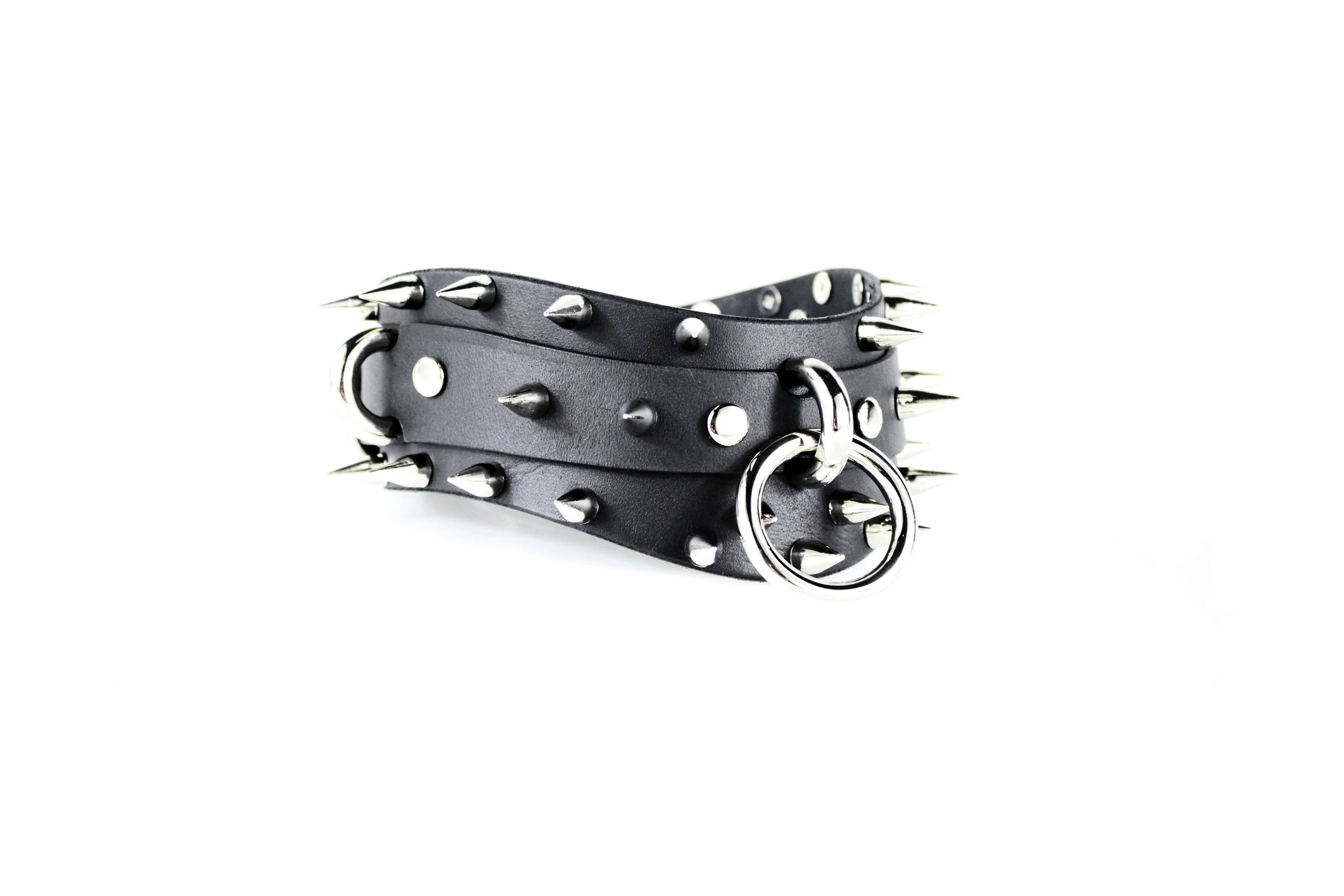 Spiked BDSM Collar made of premium black leather with polished silver spikes and a metal ring for attachment.