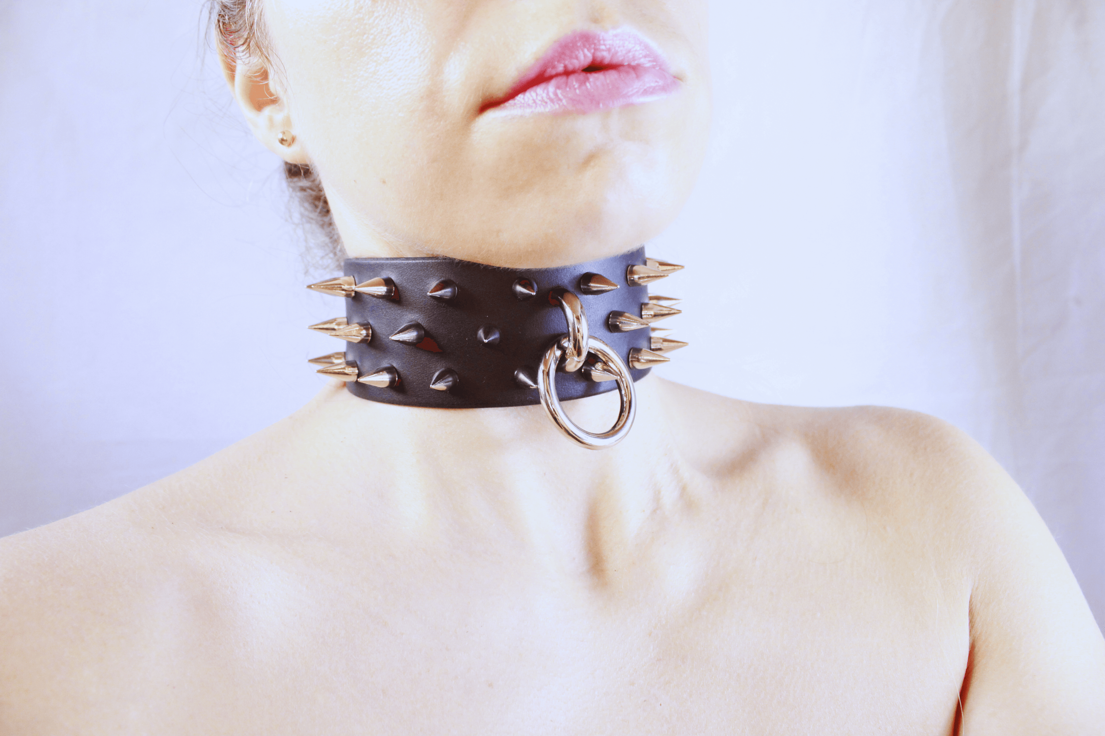 Dominion Leather Collar – Spiked BDSM Posture Collar Choker on a model's neck showcasing gothic elegance.