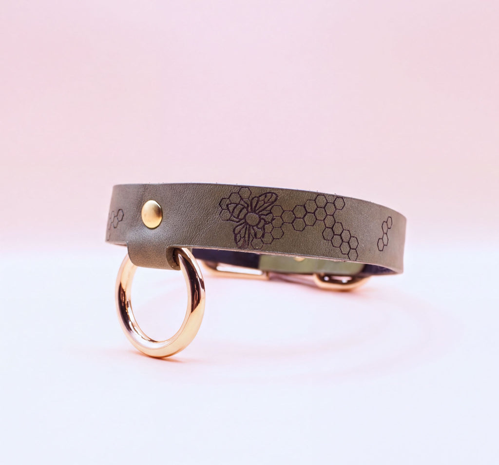 Discreet leather choker collar with gold-toned hardware for BDSM and submissive jewelry, ideal for everyday wear.