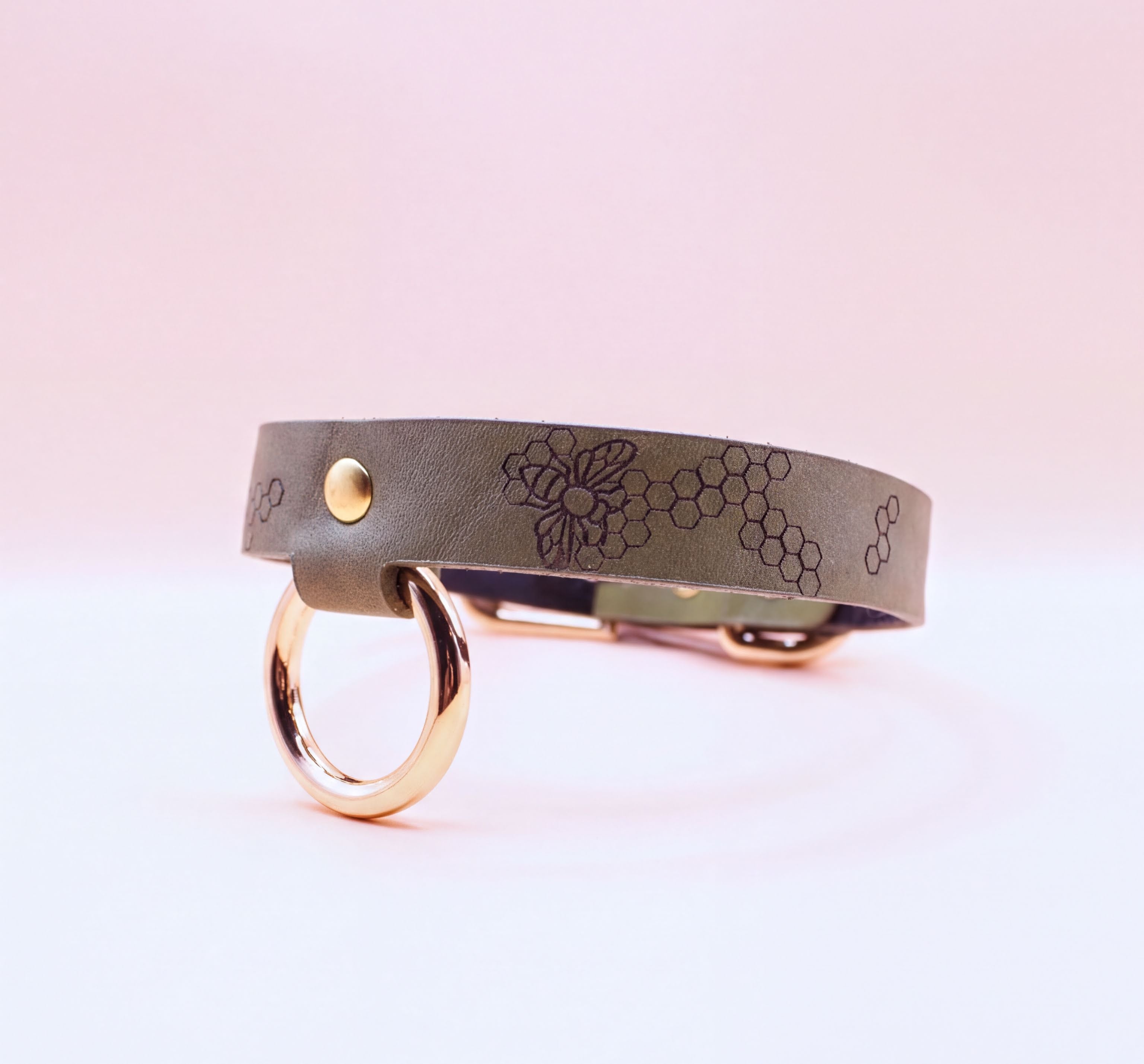 Discreet leather choker collar with gold-toned hardware for BDSM and submissive jewelry, ideal for everyday wear.