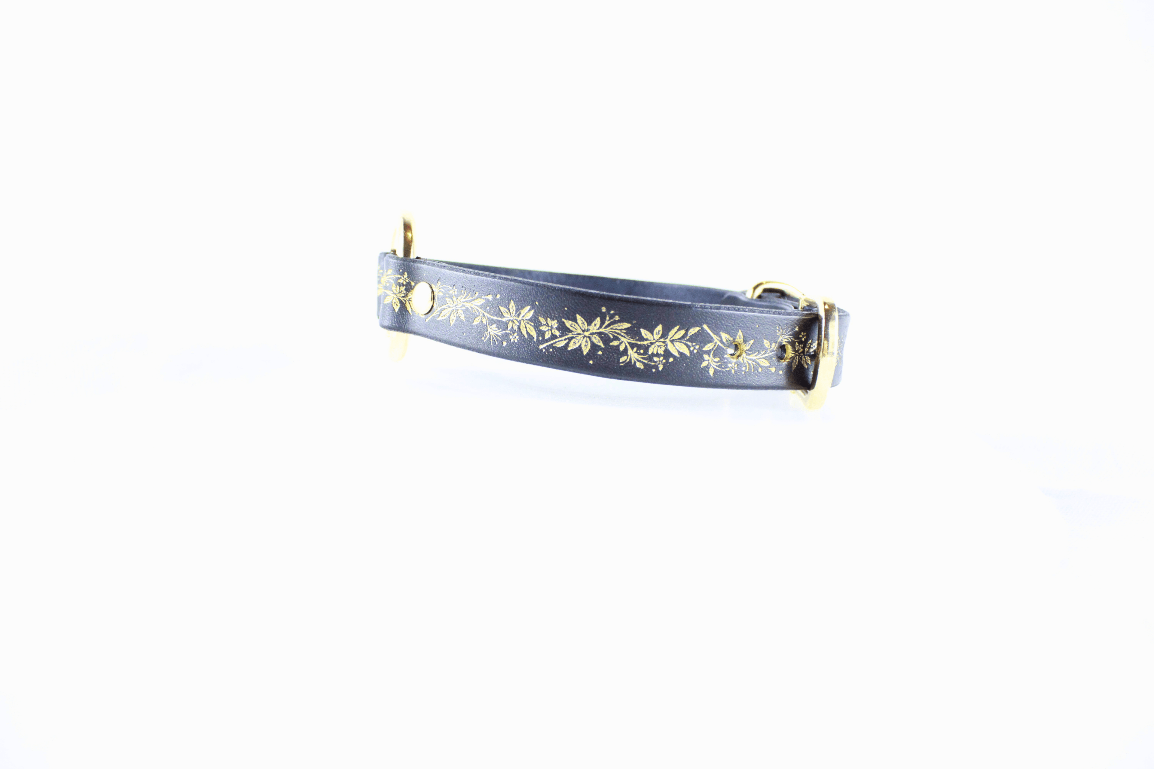 Black Leather Fetish Collar with golden floral pattern showcasing elegance and style.