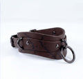 A brown leather choker necklace with metal rings and a metal clasp.