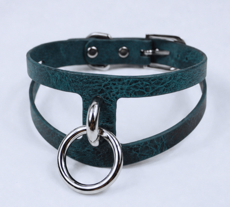 A dark green choker necklace with a silver ring and buckle.