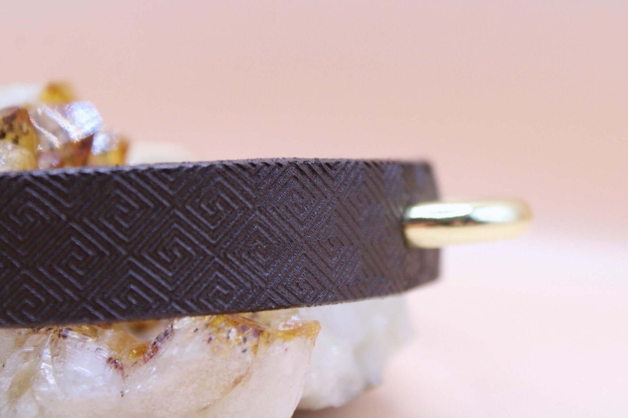 Dark brown leather day collar with geometric pattern and gold accent, ideal for discreet submissive jewelry.
