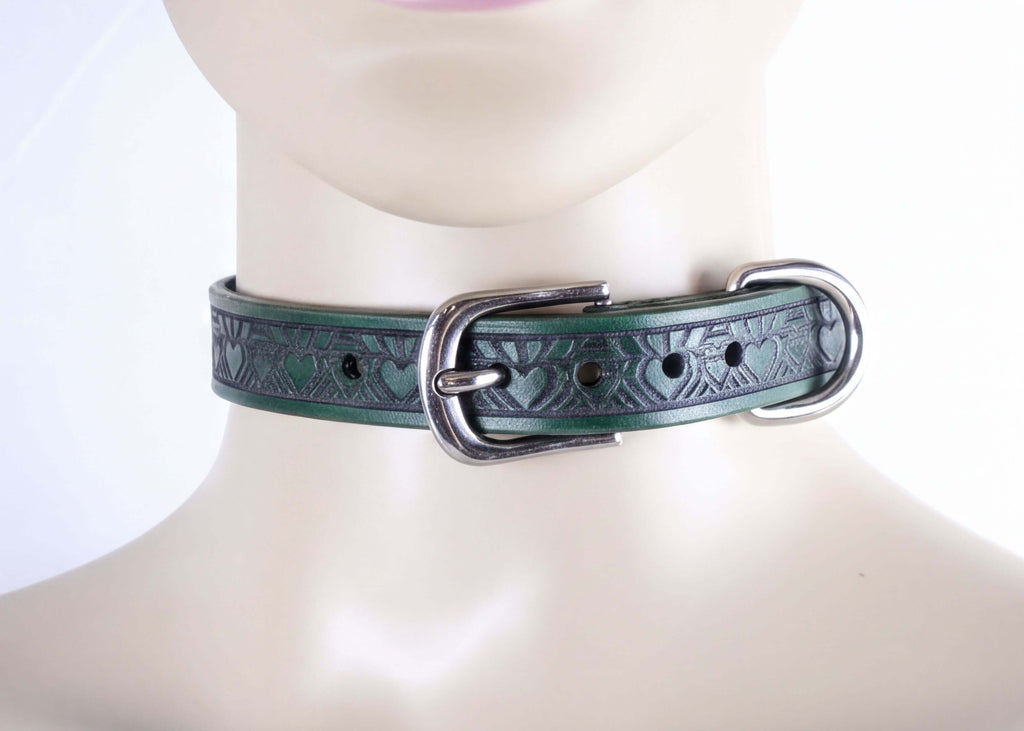 A close-up image of a green leather choker necklace with a metal buckle.