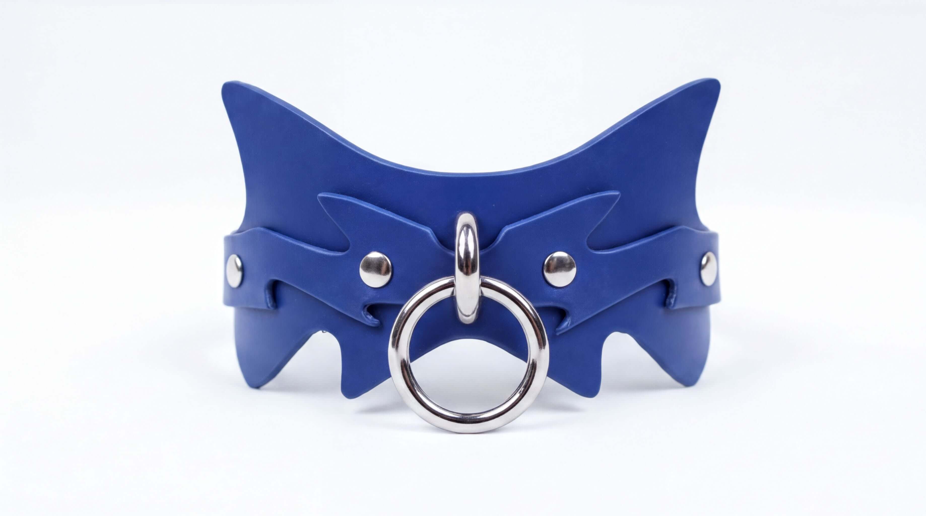 A blue leather collar with a silver ring and buckle.