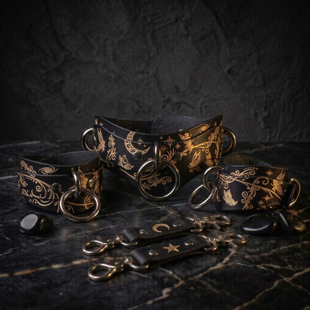a collection of ornate leather straps and charms, including a corset-style harness and several decorative metal pieces, all set against a dark background.