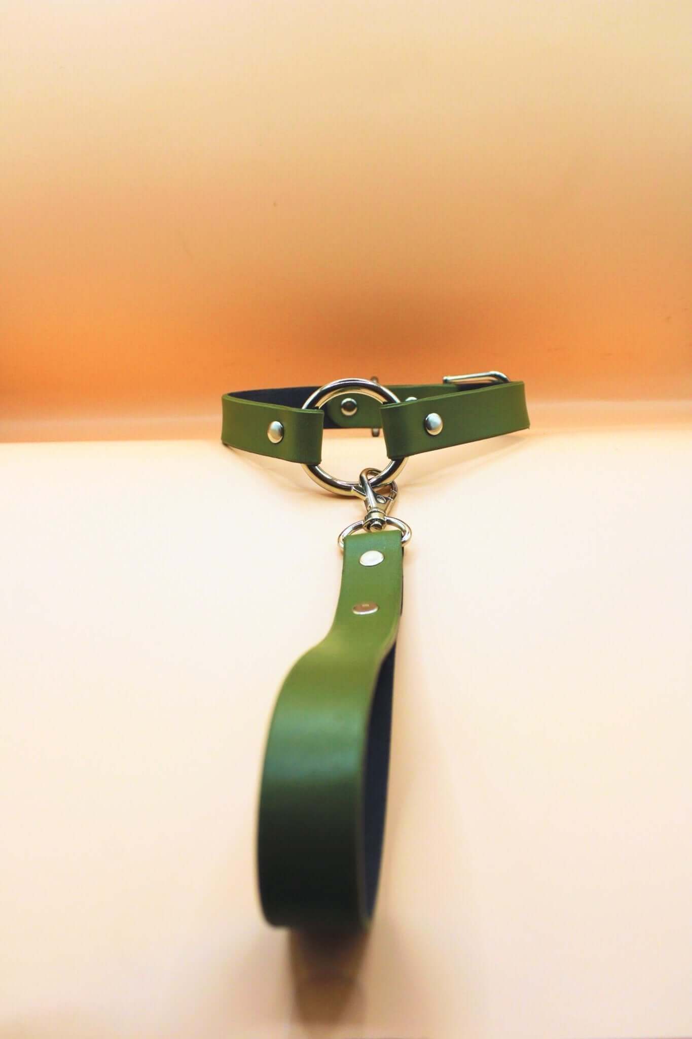 Olive green leather discreet collar and leash set for BDSM, ideal for submissive jewelry and bondage accessories.