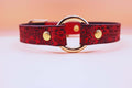 Handmade red leather submissive collar with floral design and gold hardware, perfect for discreet day use in BDSM and pet play.