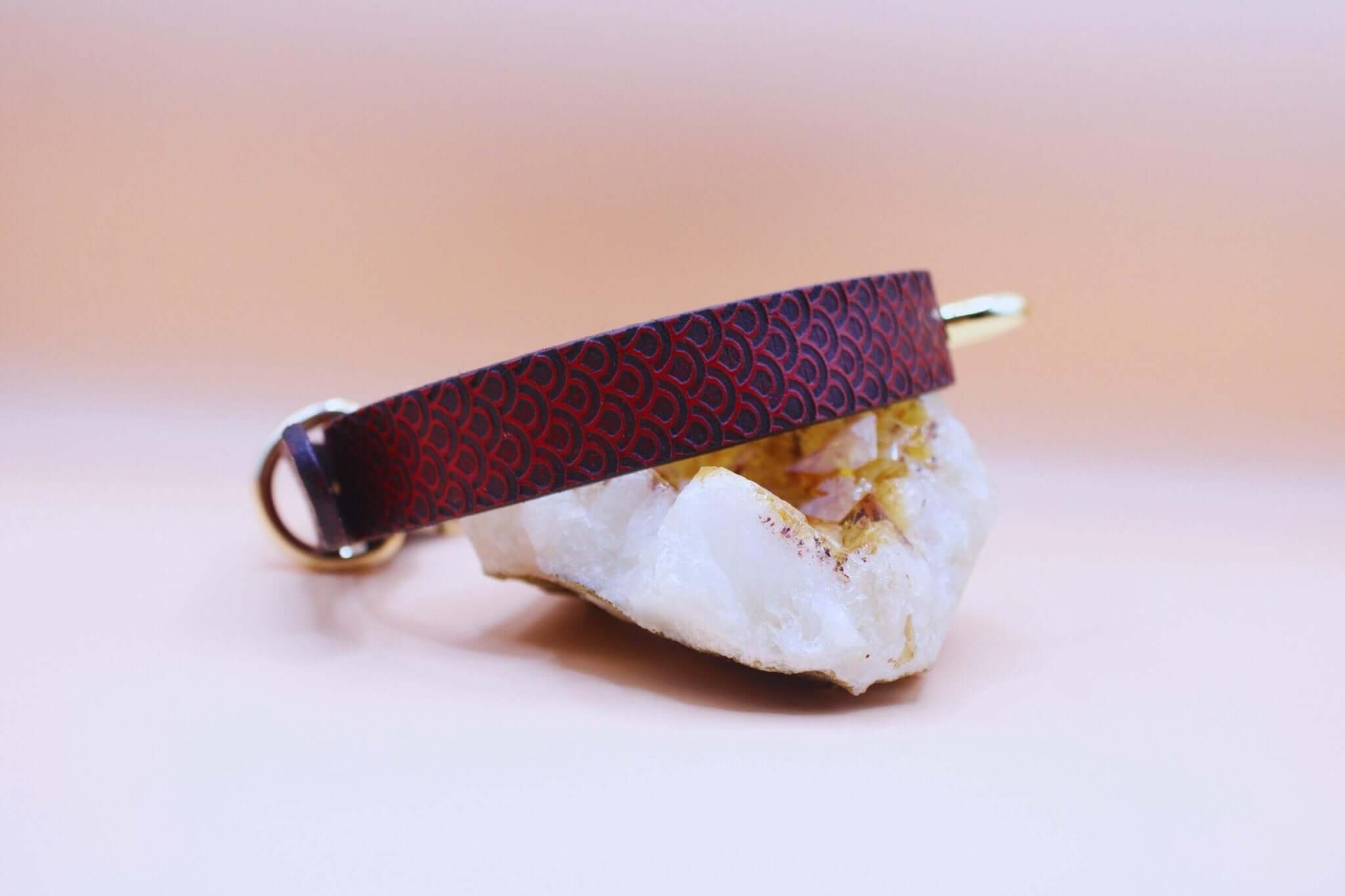 Discreet red leather choker collar with scale-inspired texture, ideal for BDSM or everyday wear.