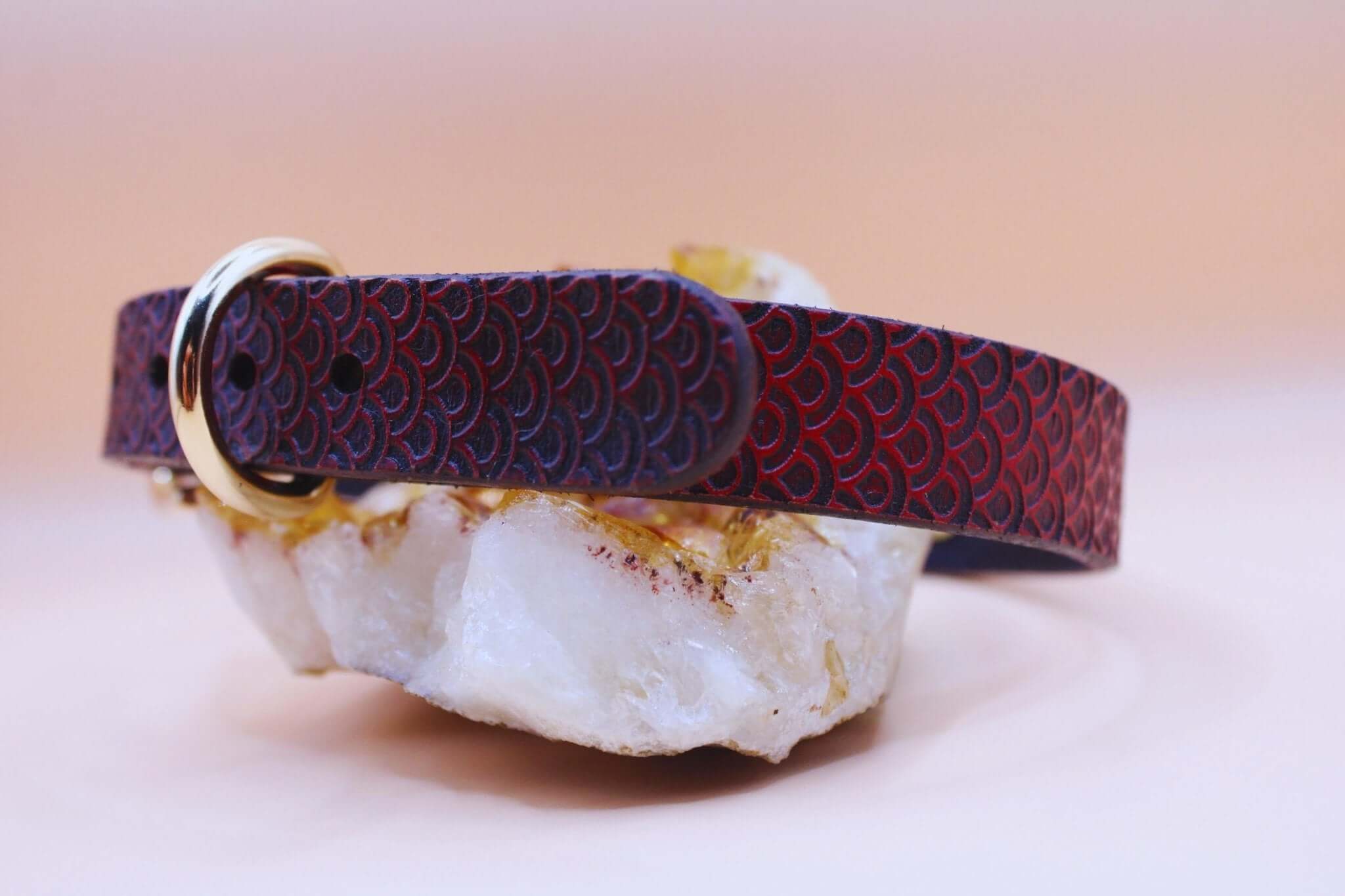 Red leather day collar with scale texture, a stylish accessory for submissive jewelry and discreet bondage wear.