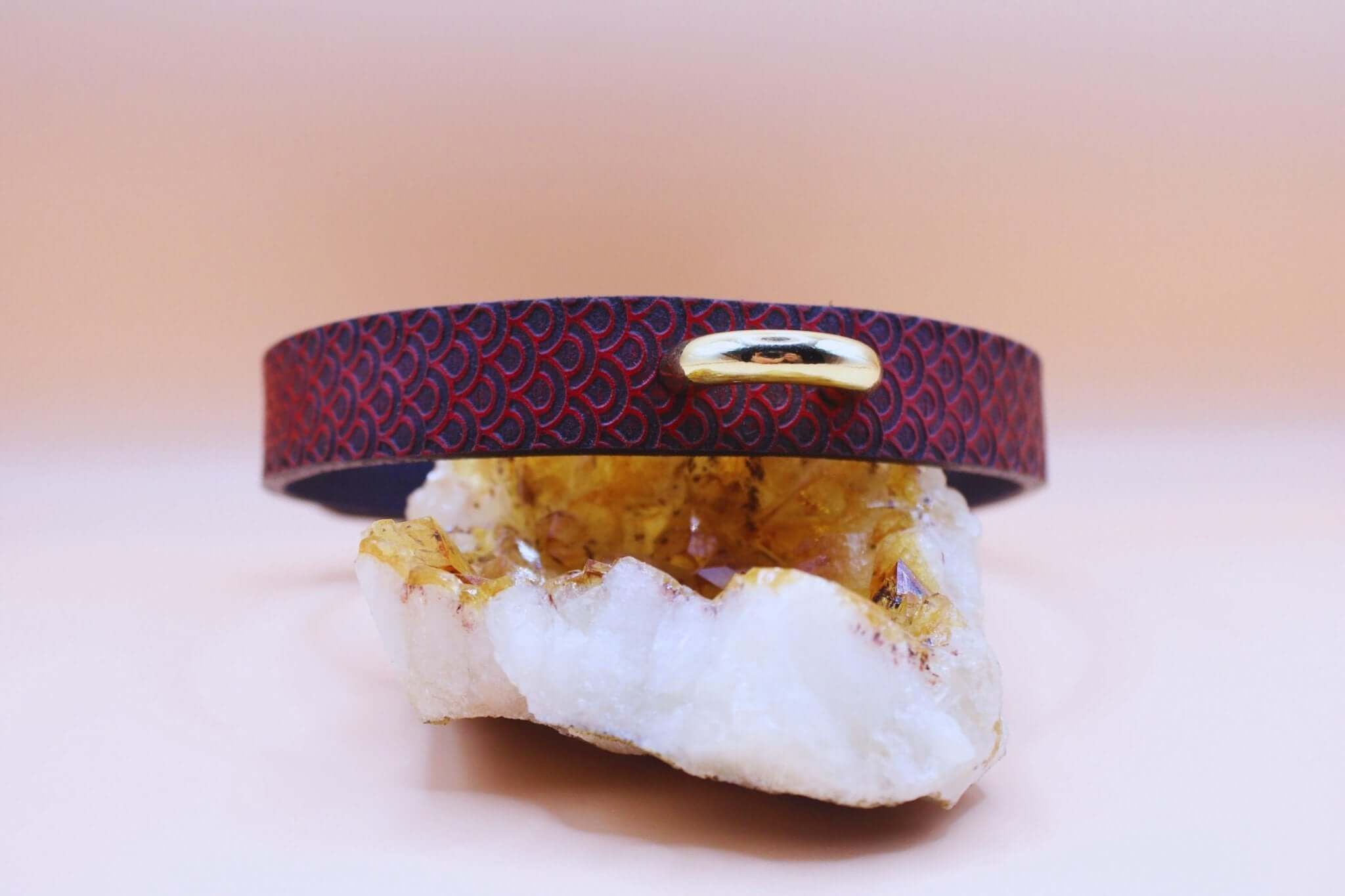 Elegant red leather submissive collar with scale texture, perfect for discreet daily wear and BDSM fashion.