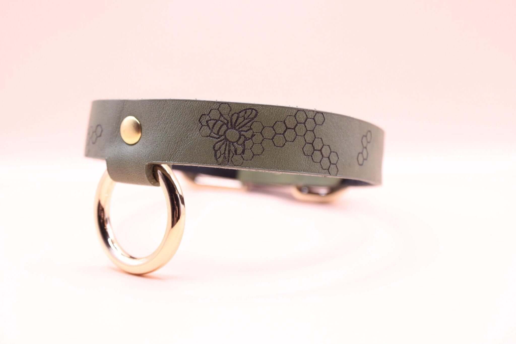 Handcrafted discreet leather choker collar featuring floral design and gold hardware, perfect for BDSM and everyday fashion.