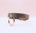 Discreet leather choker collar with gold-toned hardware for BDSM and submissive jewelry, ideal for everyday wear.