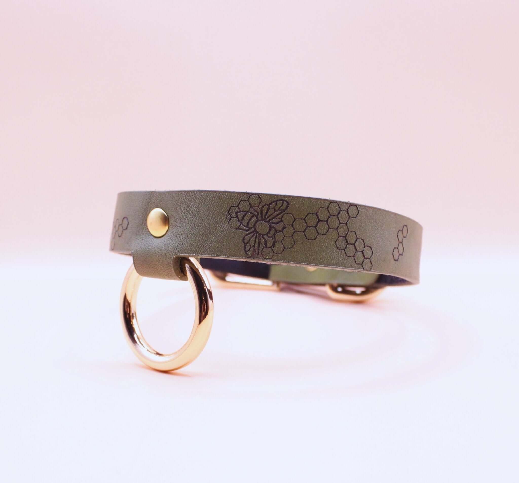 Discreet leather choker collar with gold-toned hardware for BDSM and submissive jewelry, ideal for everyday wear.