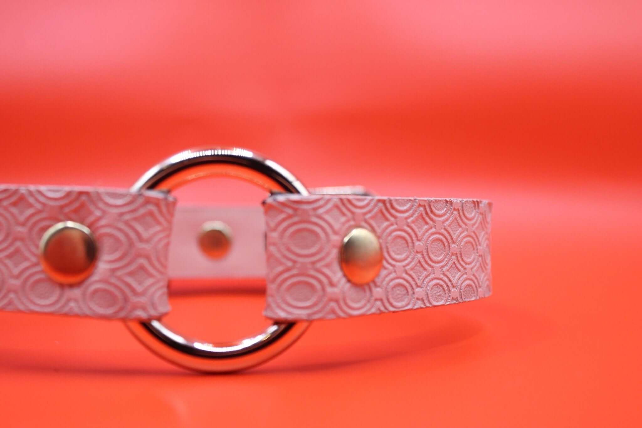 Discreet pink BDSM day collar with metal ring, ideal for submissive jewelry and daily wear in bondage play.