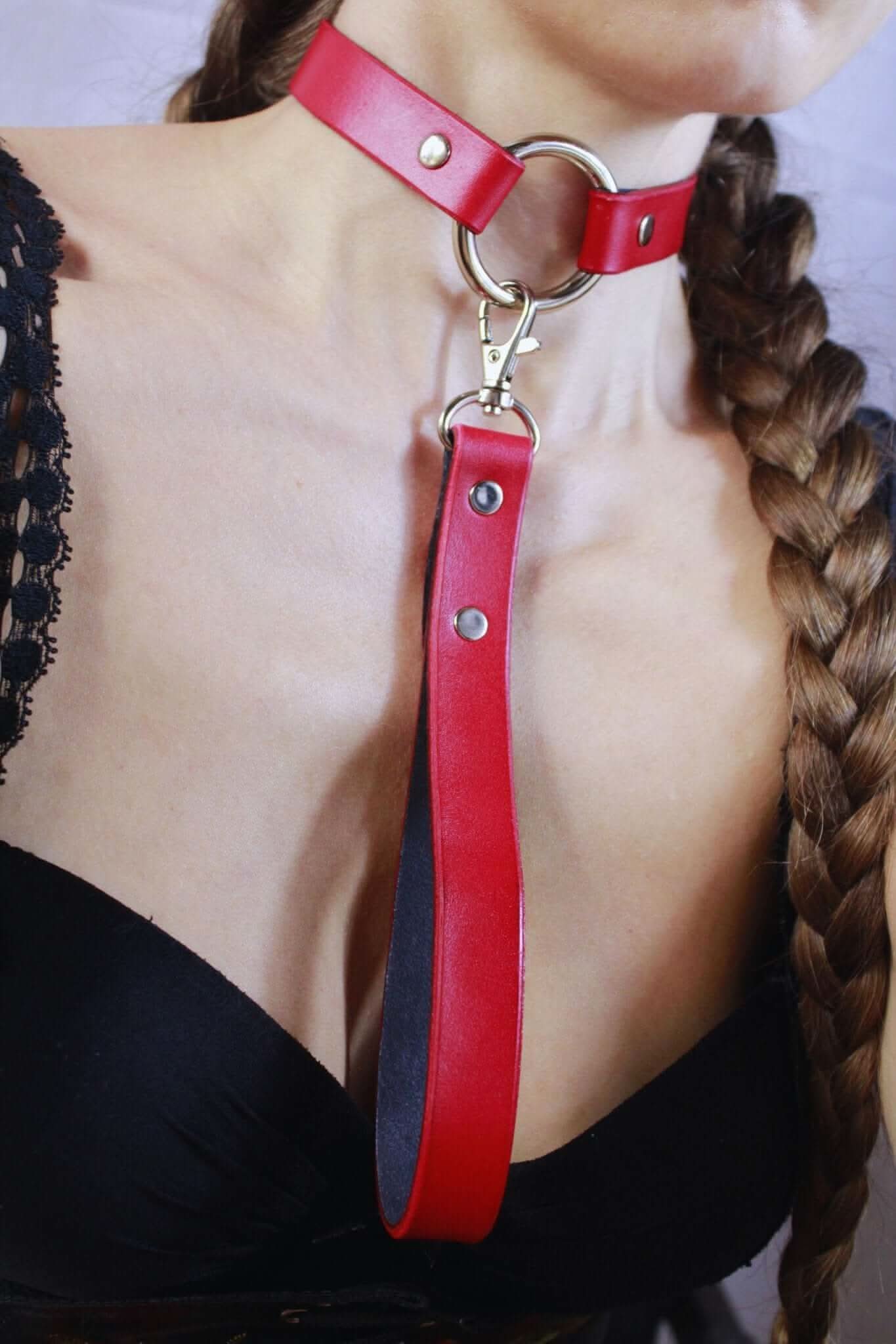 Red leather discreet sub collar with ring, perfect for BDSM jewelry and submissive styles in bondage gear.