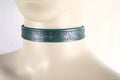 Elegant green leather submissive collar, perfect for discreet BDSM wear or stylish accessorizing in daily outfits.