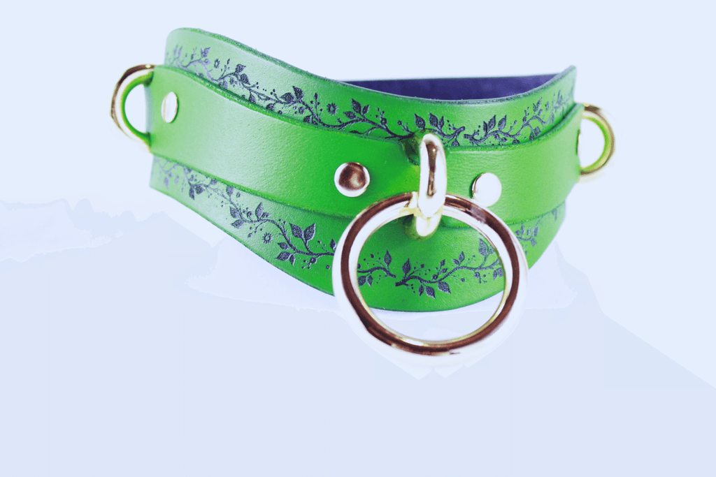 Green Vine Leather Submissive Collar featuring a delicate black vine pattern and polished rings.