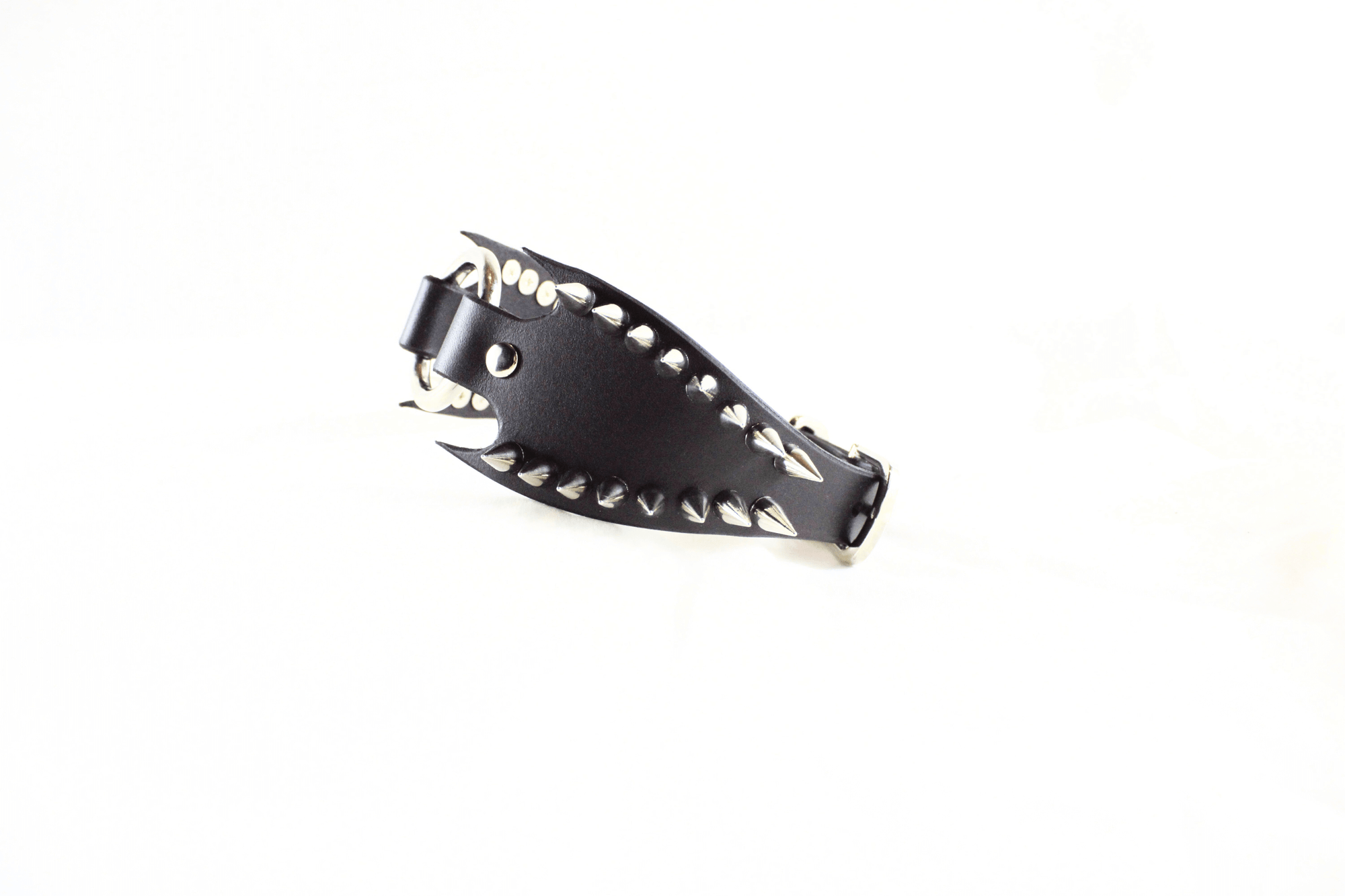 Leather Submissive Collar featuring sharp metallic spikes and fang edges for a bold BDSM posture piece.