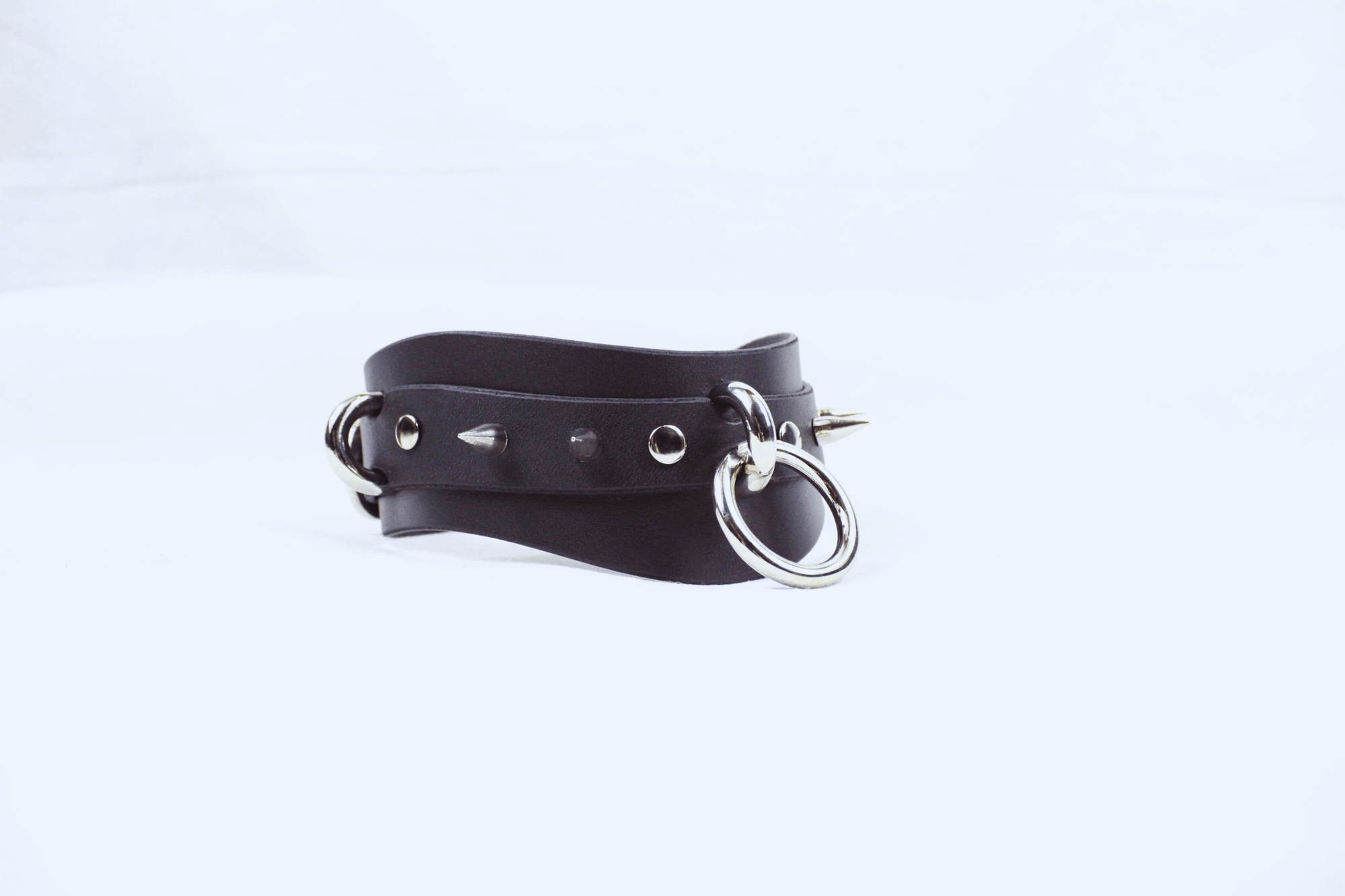 Spiked BDSM Collar – Wide Leather Posture Choker for Submissive Play, featuring spikes and metal rings.