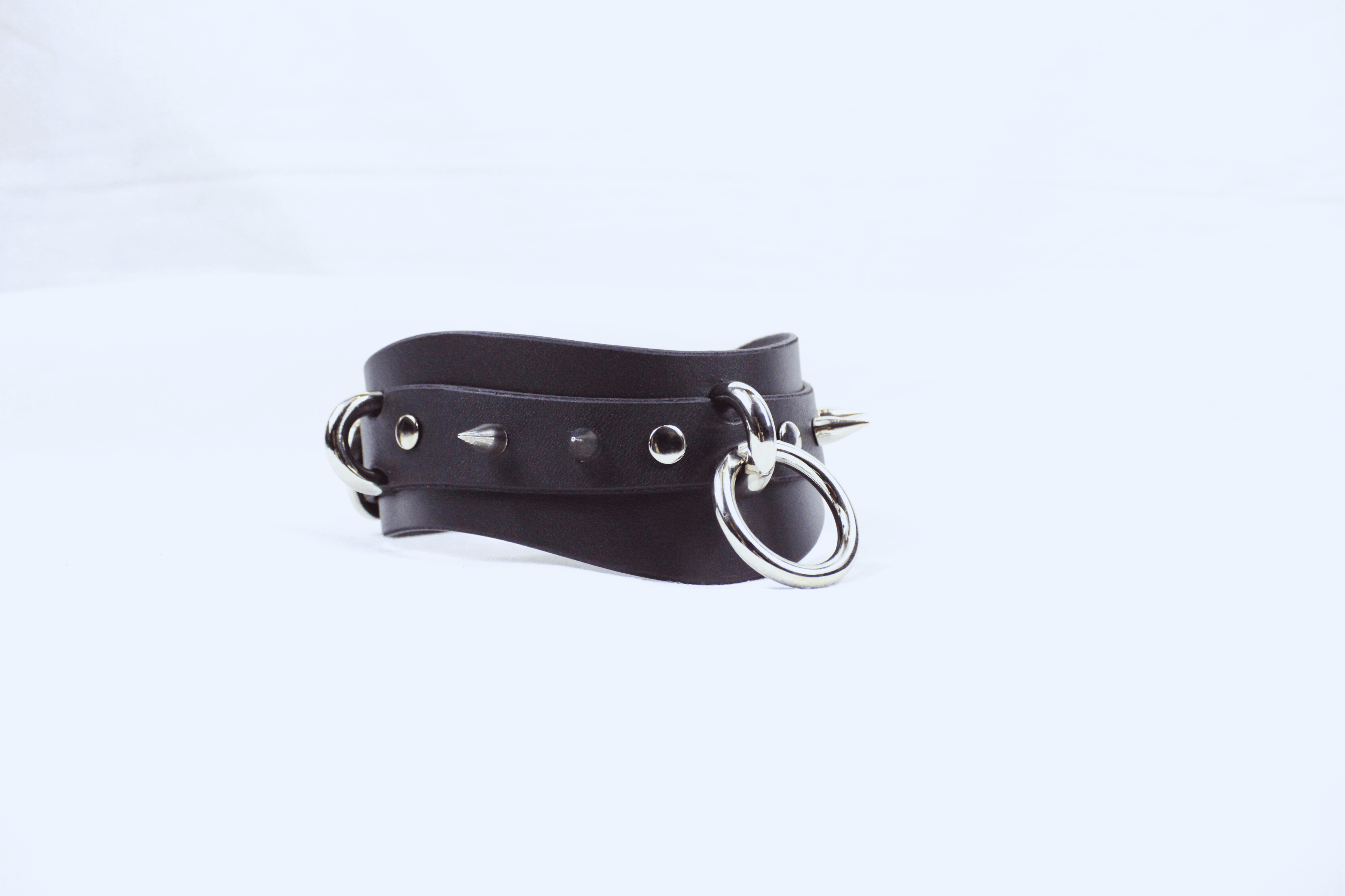 Spiked BDSM Collar – Wide Leather Posture Choker for Submissive Play, featuring spikes and metal rings.