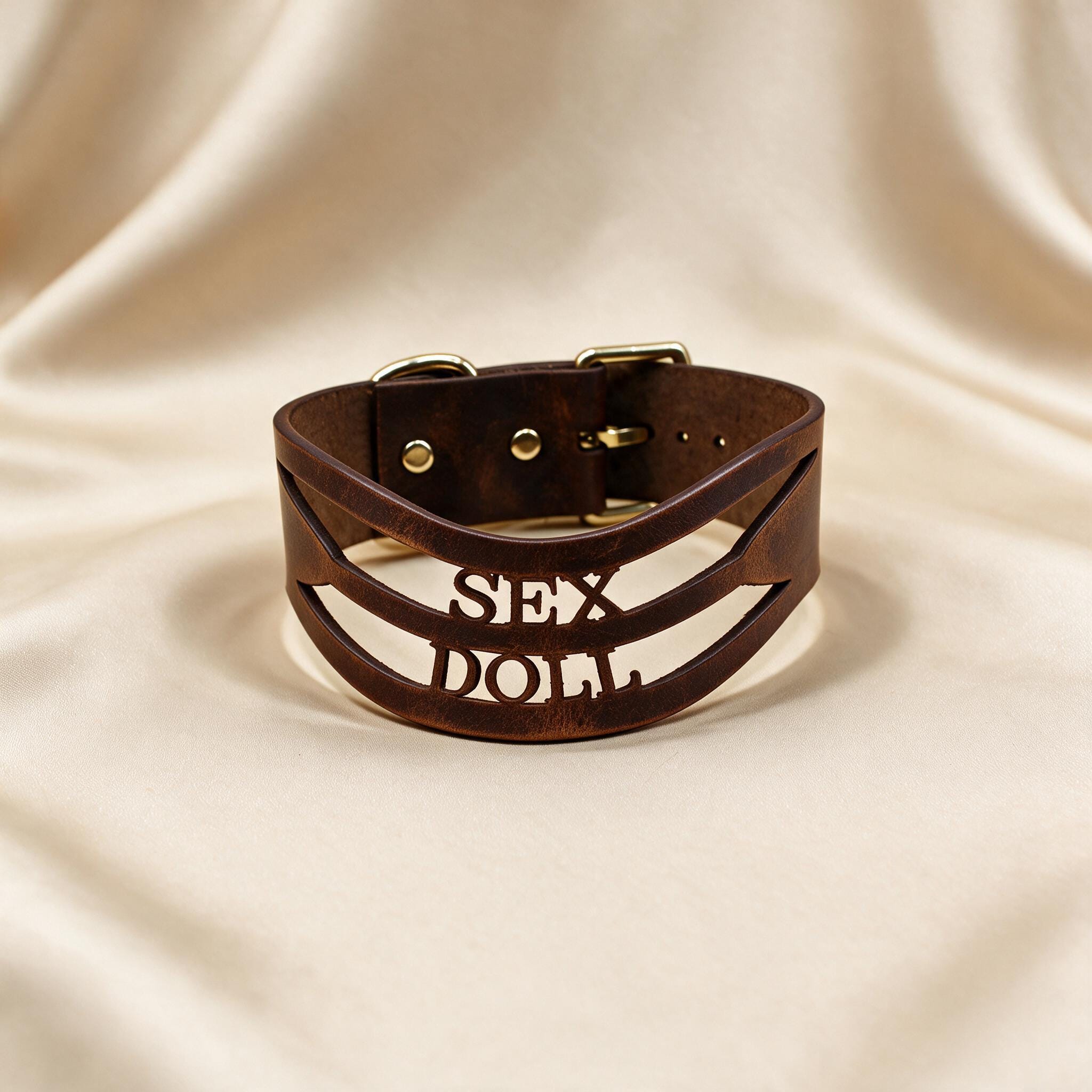 A brown leather choker necklace with the word "SEX" printed on it.