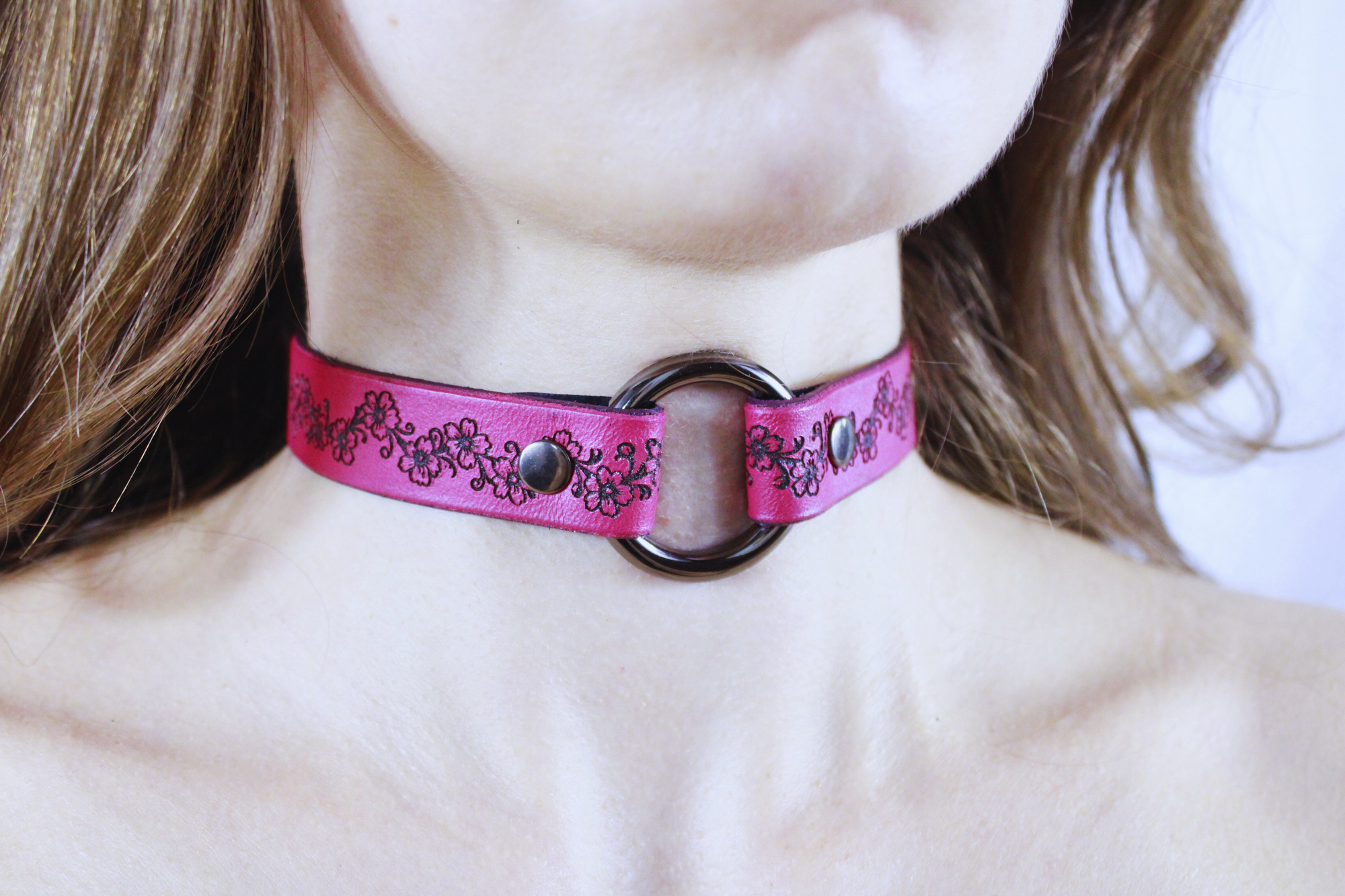 BDSM Collar Floral Vine Leather Choker displayed on model, featuring intricate floral design and central O-ring.