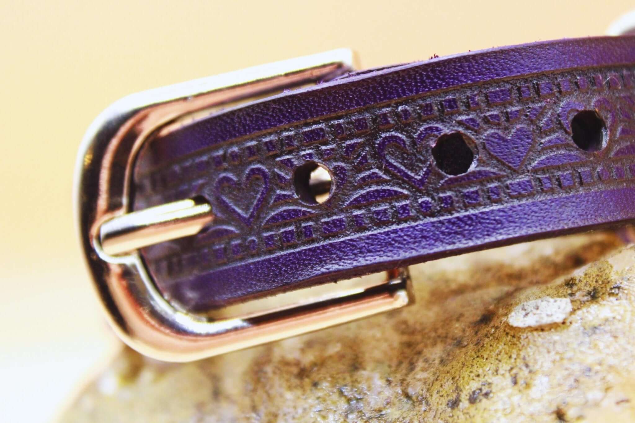 Elegant purple leather sub collar with heart design and metallic buckle, perfect for BDSM and discreet day wear.