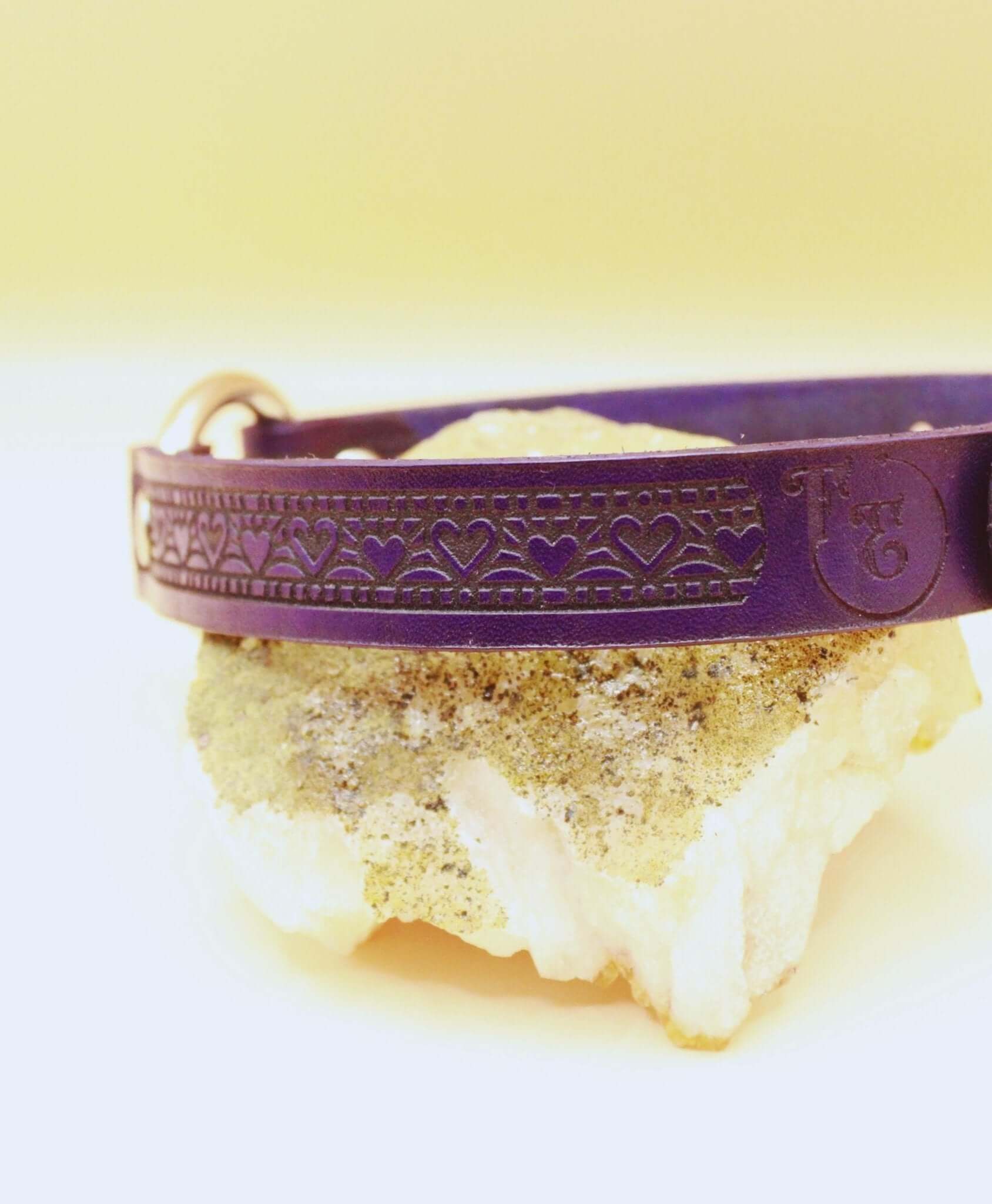 Elegant purple leather submissive collar with heart design, perfect for BDSM and discreet day wear.