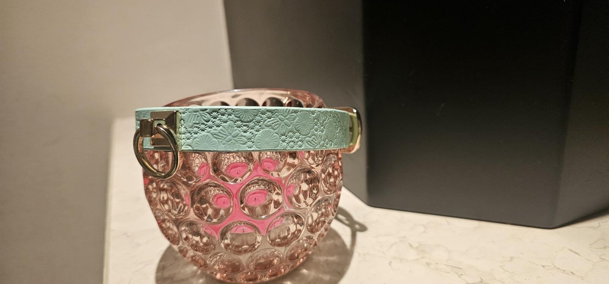 Elegant pastel blue leather collar showcased on a decorative glass vase, perfect for BDSM and DDLG aesthetics.