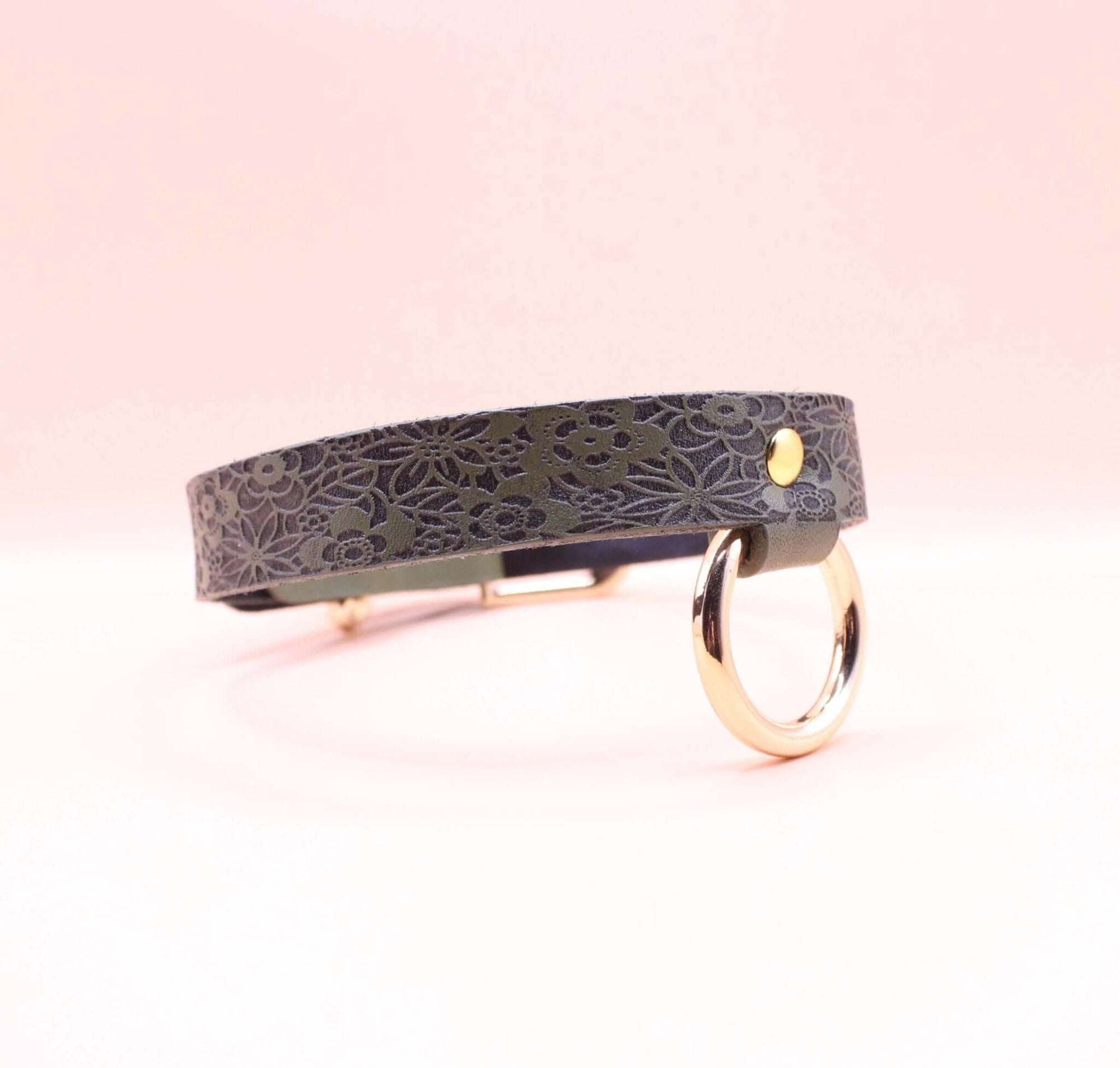 Elegant discreet day collar in premium leather, featuring floral design and metal ring, perfect submissive jewelry accessory.
