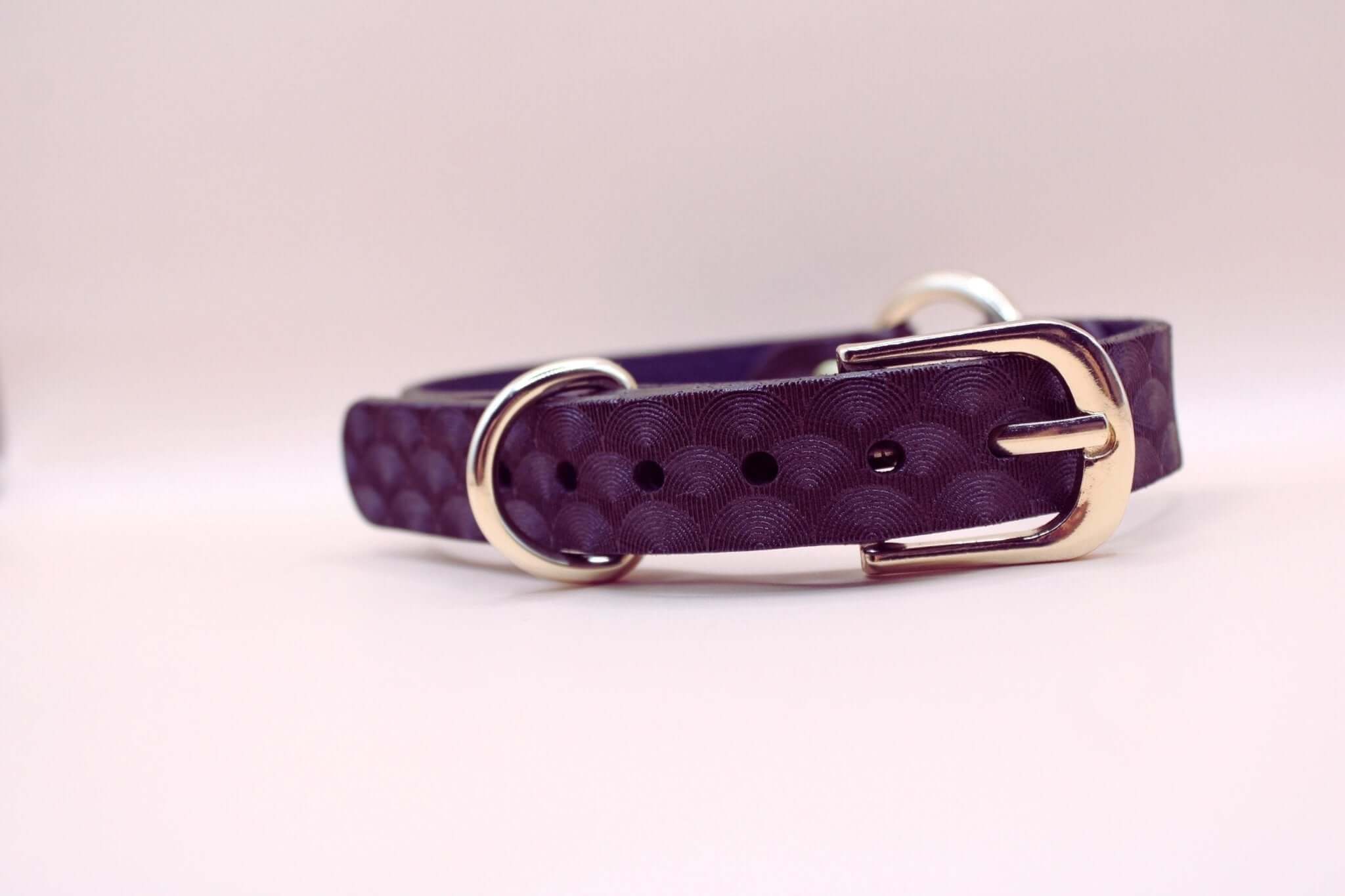 Elegant purple leather choker collar featuring scallop texture, ideal for submissive jewelry and discreet day collar needs.