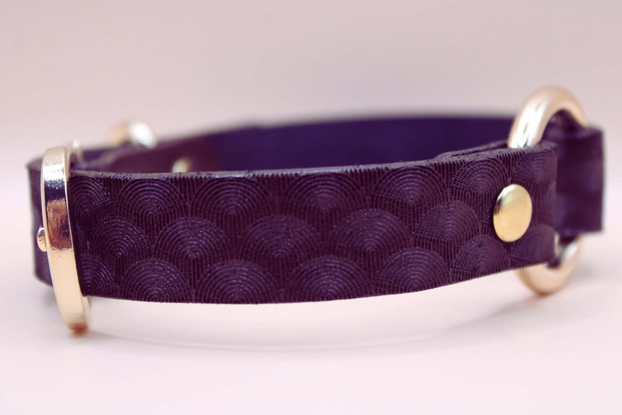 Elegant purple leather choker with scallop texture, BDSM discreet collar for submissive style and connection.