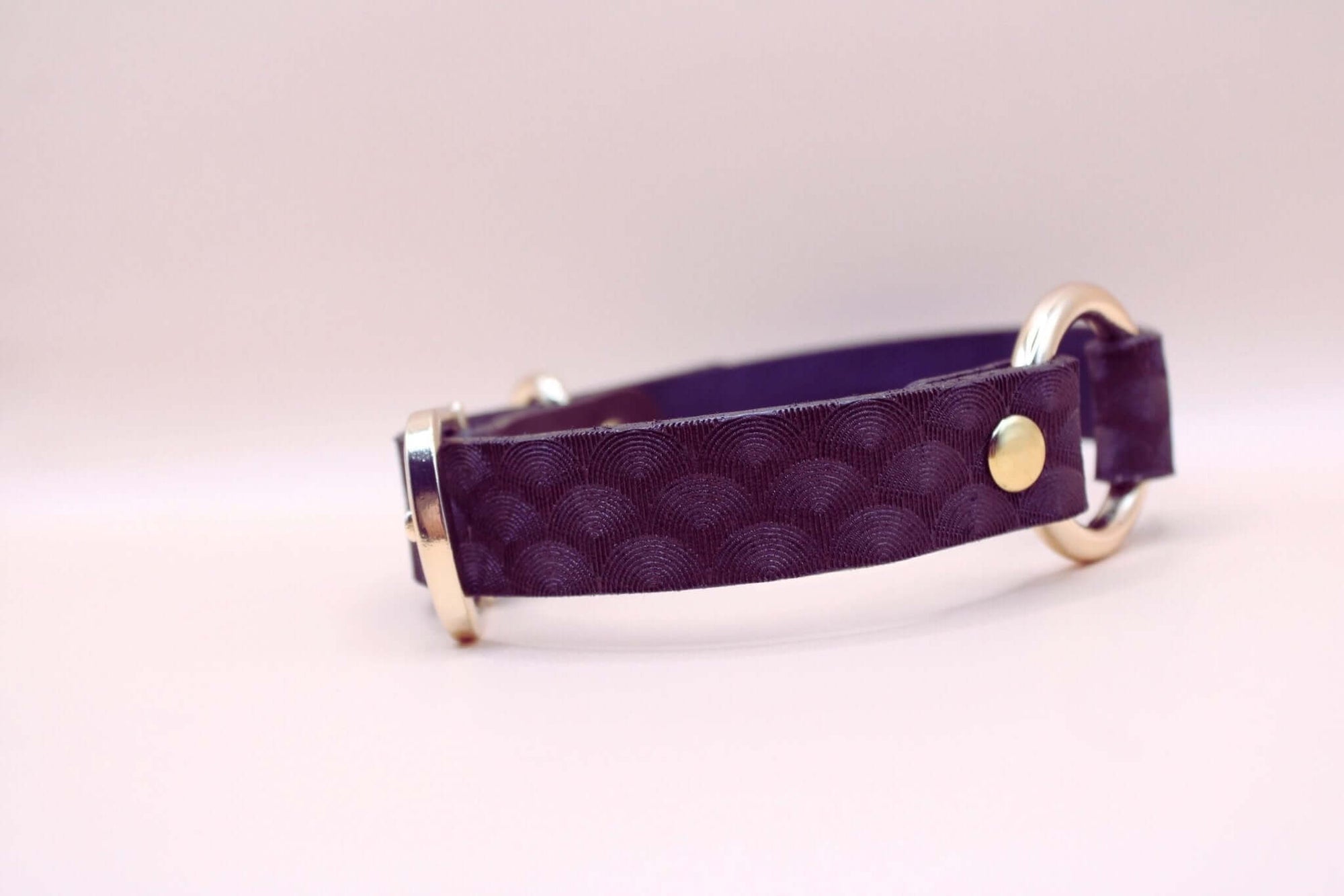Elegant purple leather choker collar with scallop texture, perfect for BDSM and discreet day wear.