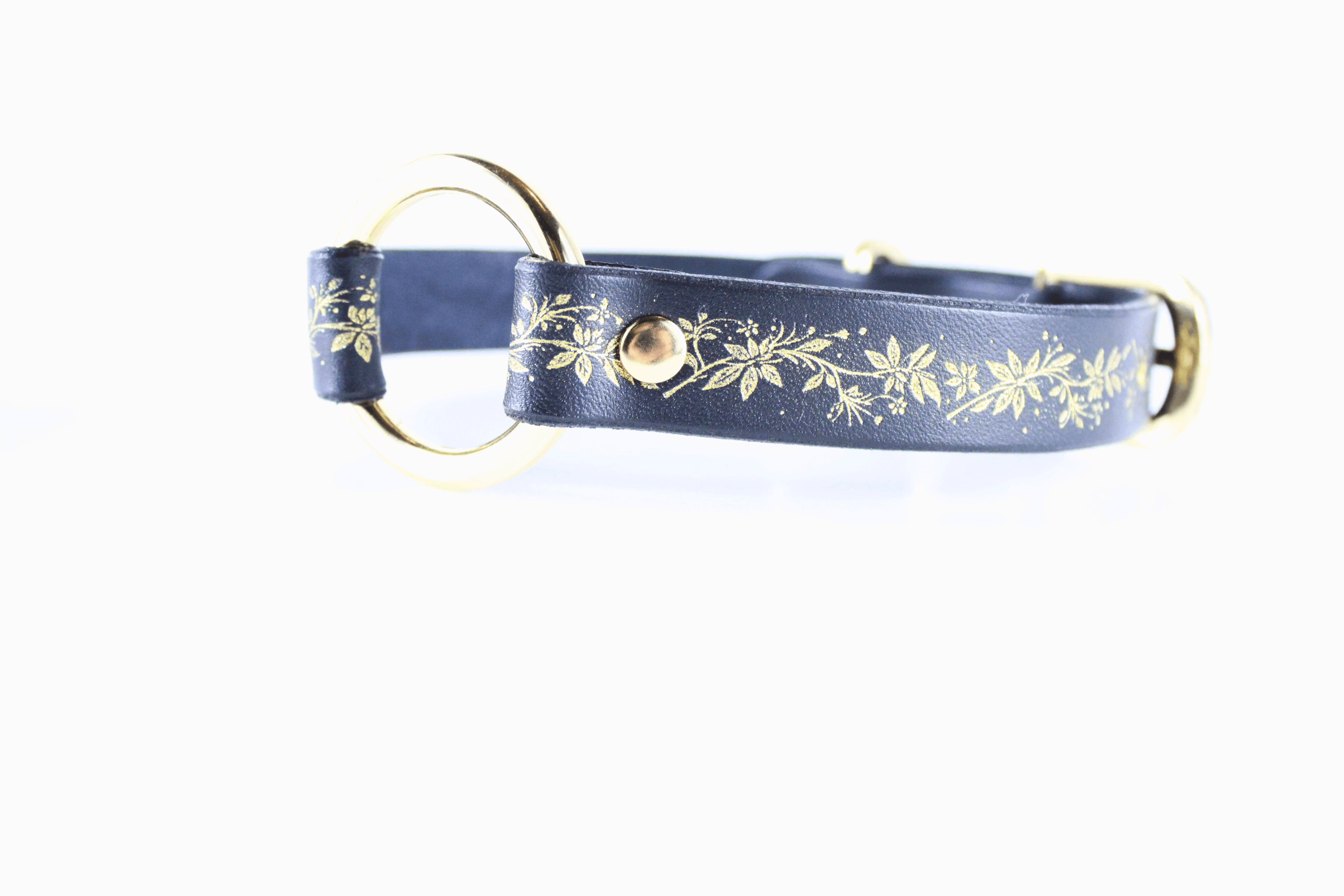 Black Leather Fetish Collar featuring a golden floral pattern and polished O-ring for bondage or fashion.