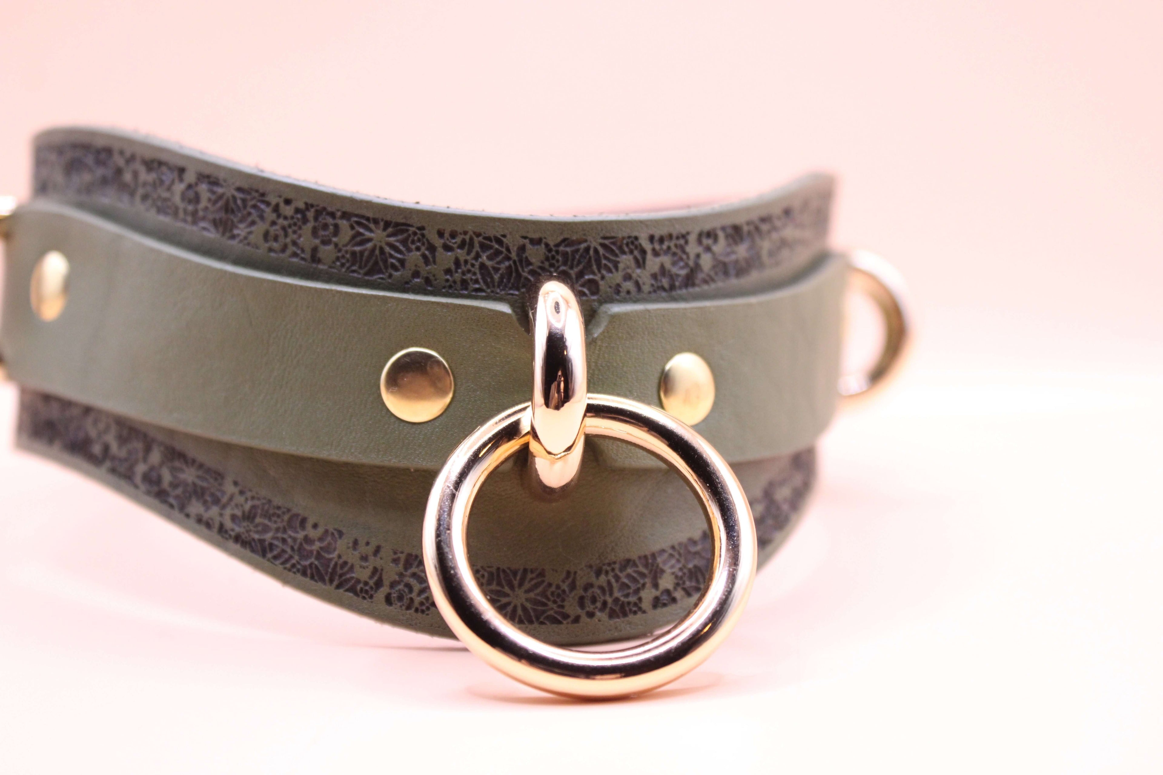 Avocado green leather choker with gold hardware and decorative detail, ideal for fashion and BDSM purposes.