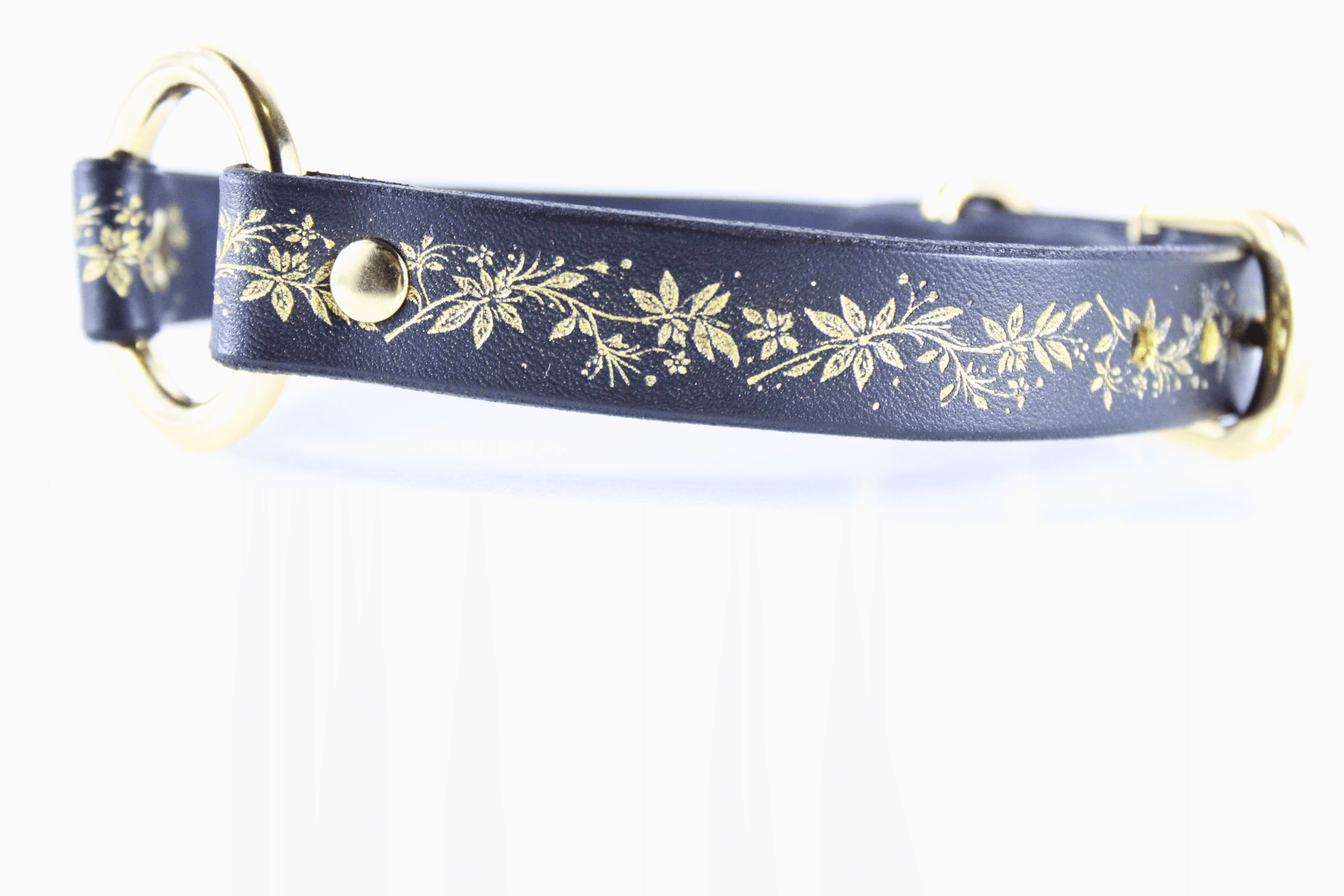 Black Leather Fetish Collar with golden floral pattern and polished O-ring, elegant and subtle design.