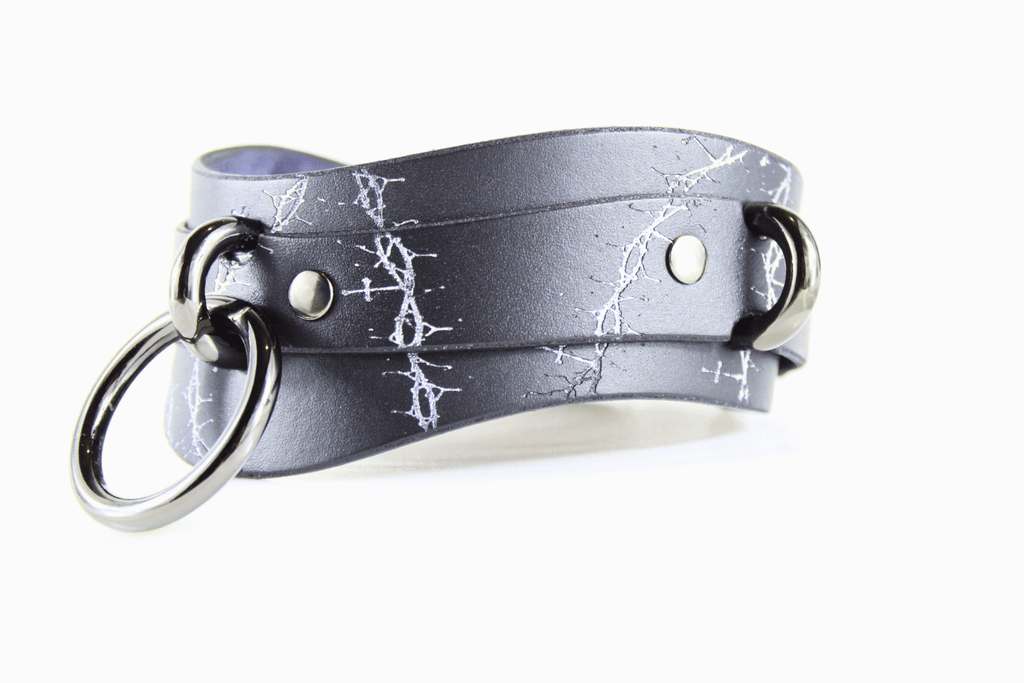 Thorned Submissive Collar, a gothic BDSM choker featuring a thorn and cross pattern, crafted from genuine leather.